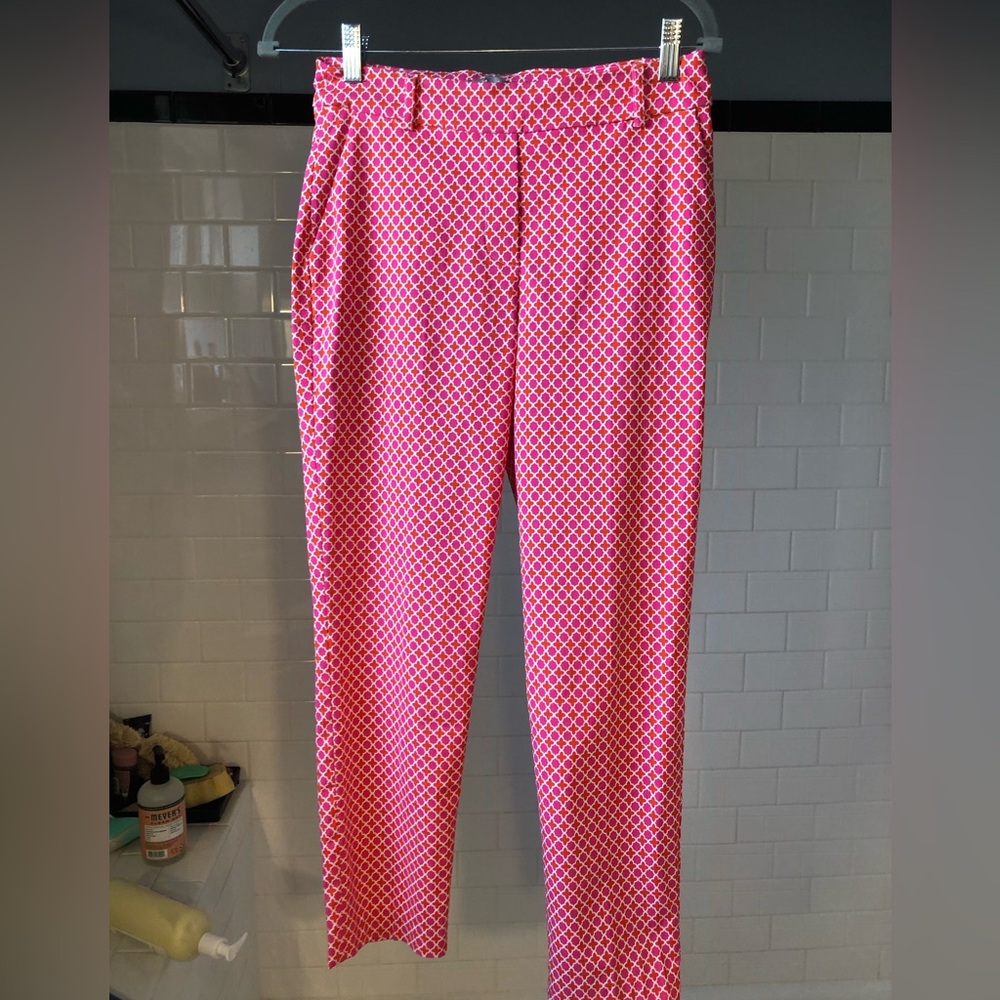 Fun stretchy pants in an orange, pink and white graphic print.